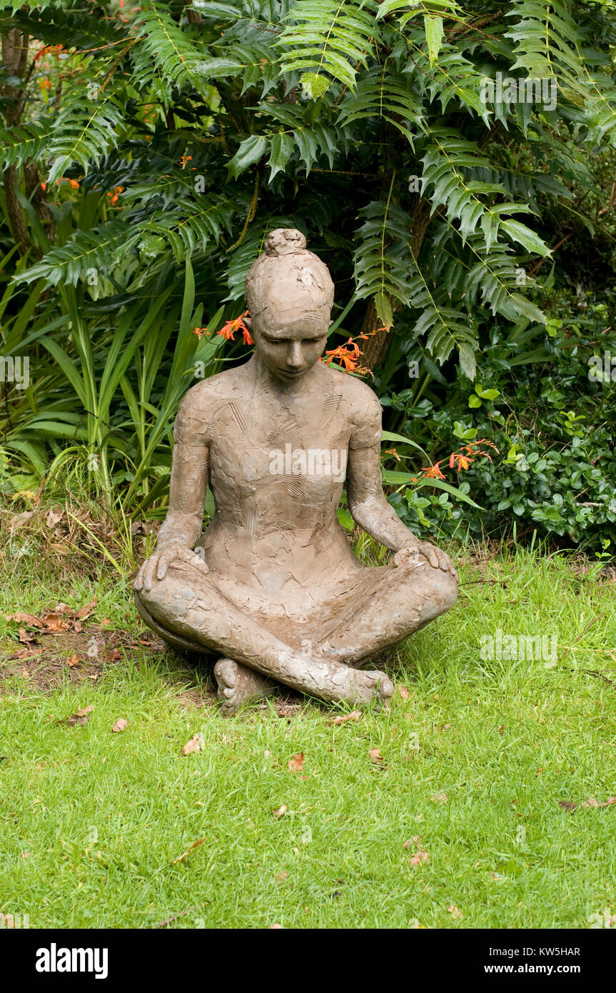 Landscape sculpture of naked seated woman Stock Photo