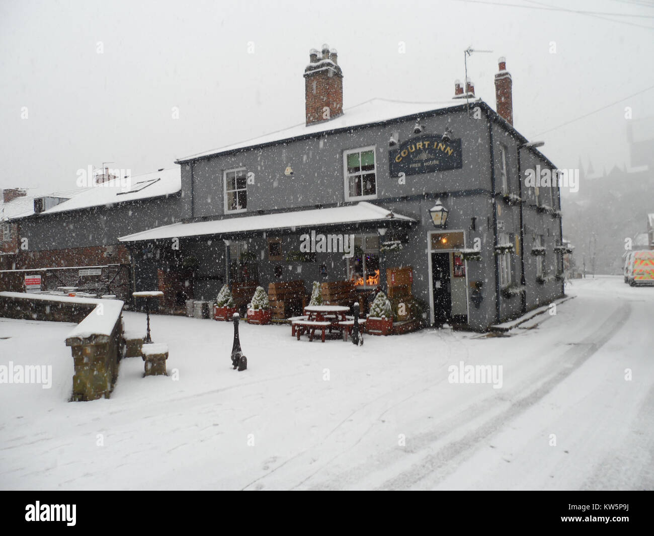 English pub/restaurant during snowfall in Durham, England, UK Stock