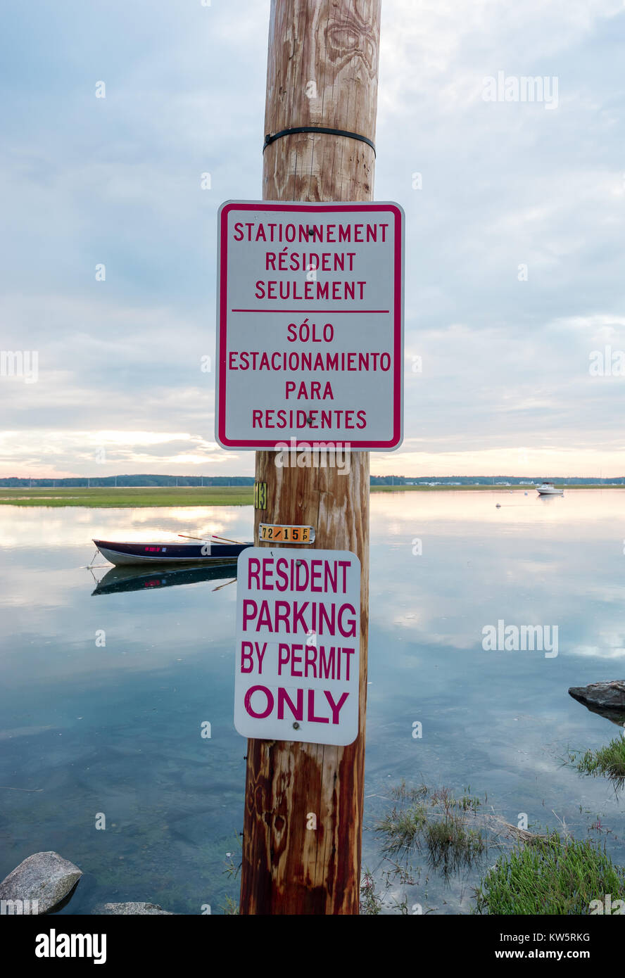 Trilingual (English, Spanish and French) No Parking Sign... In the Water! Stock Photo