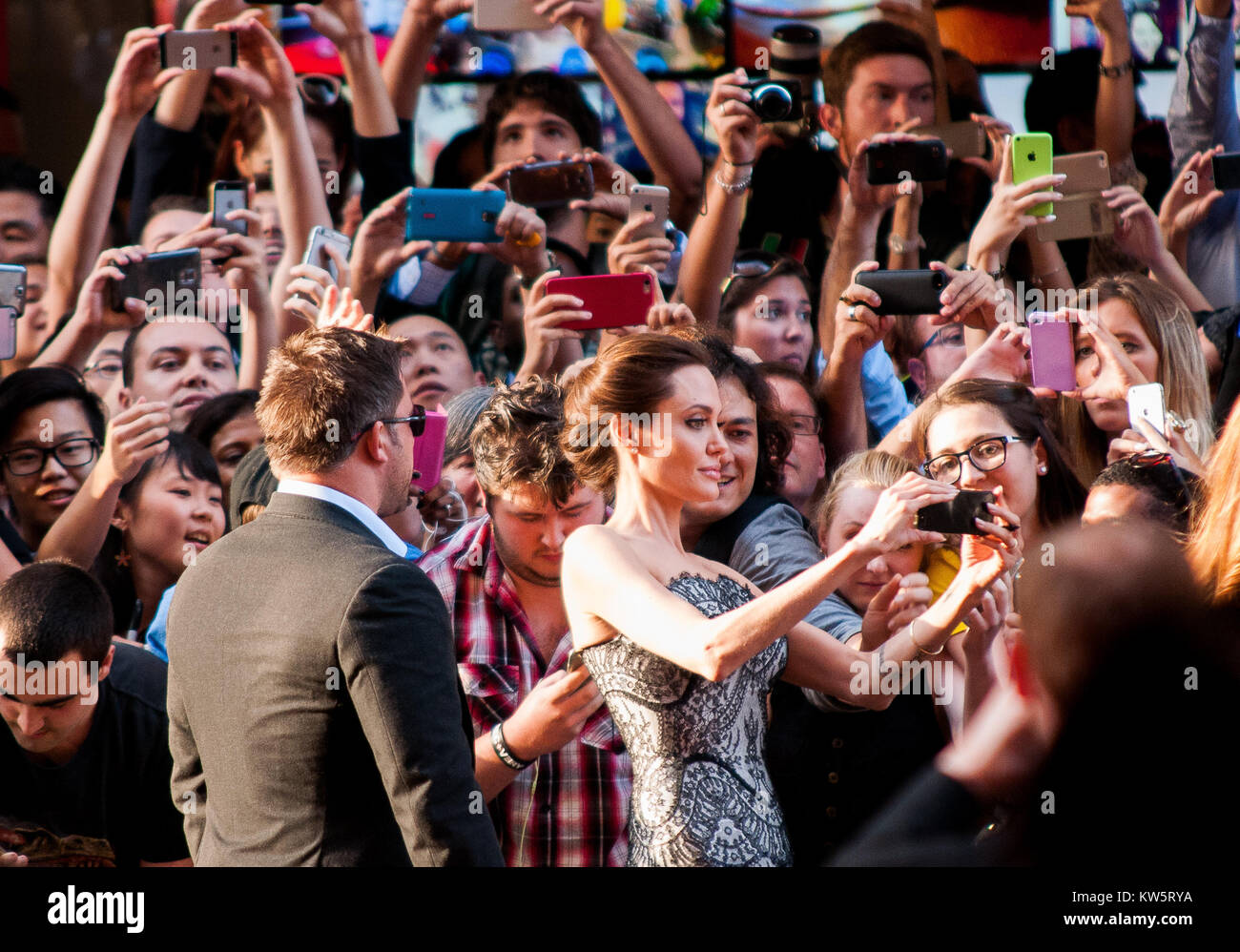 SYDNEY, AUSTRALIA - NOVEMBER 18: Miyavi Ishihara, Angelina Jolie and Jack O'Connell, at the photo call of Unbroken at Sydney Opera House on November 18, 2014 in Sydney, Australia.  People:  Angelina Jolie Stock Photo