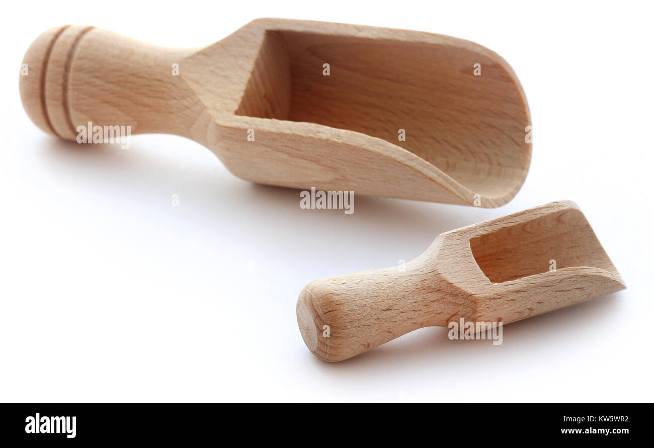 Wooden scoop over white background Stock Photo - Alamy