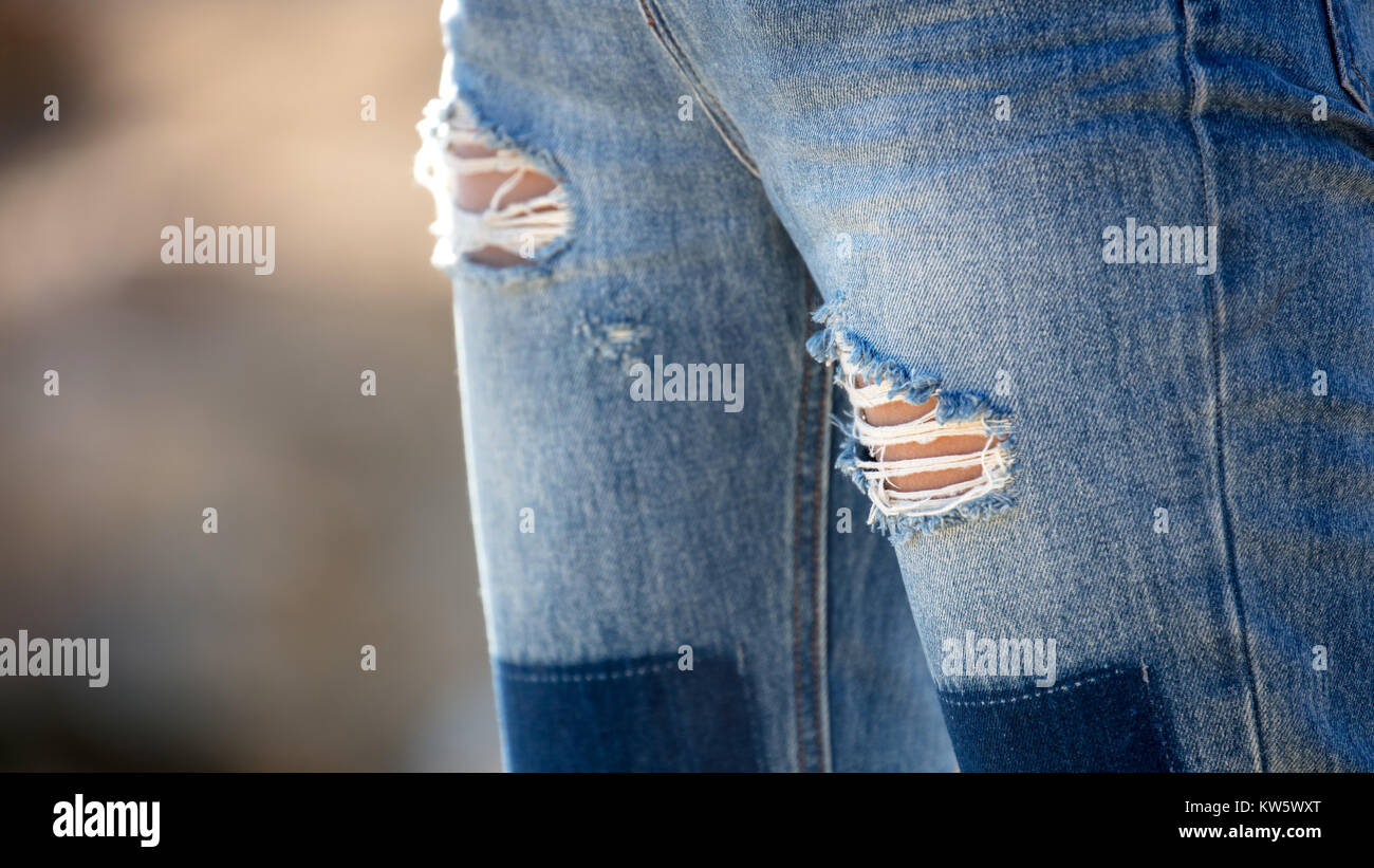 holes in jeans Stock Photo Alamy