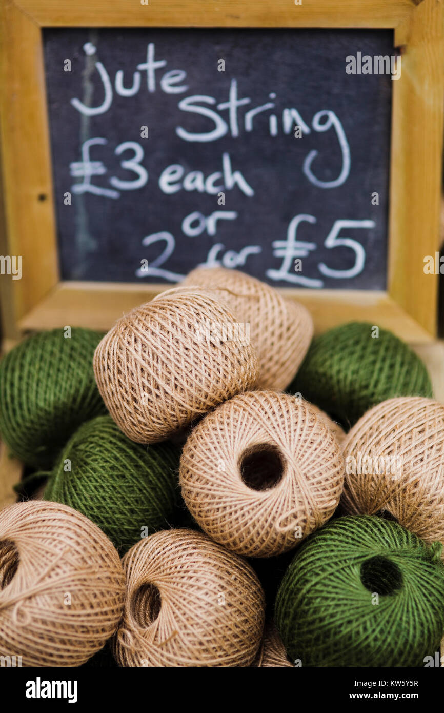 Natural jute string for sale at a market stall, UK Stock Photo