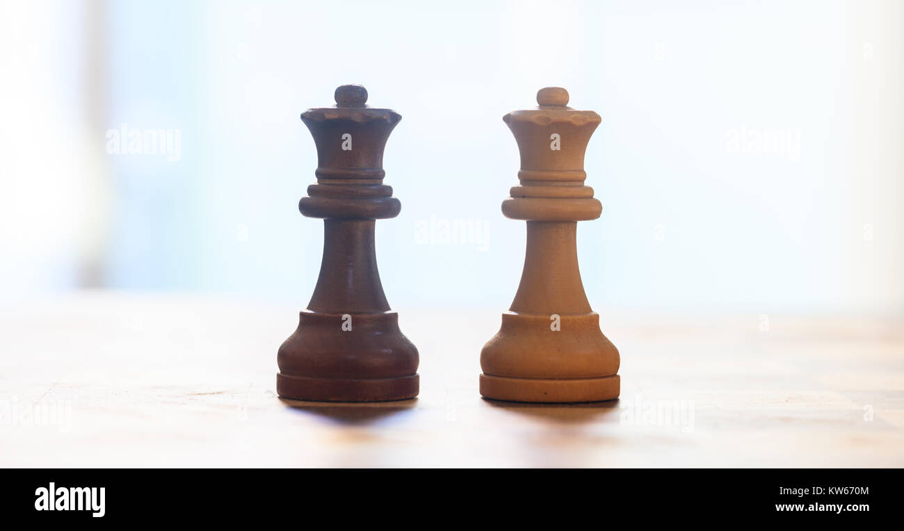 Chess pieces. Closeup view of queens with detail. Shadow, blur backdrop. Stock Photo