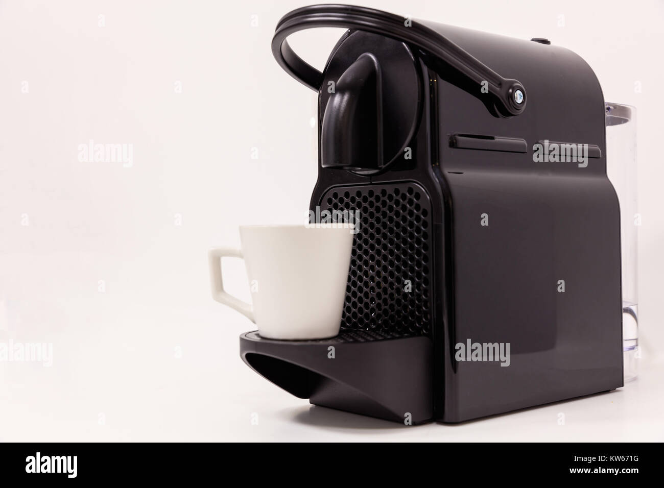 Espresso coffee maker machine with modern design. White background, close up view with details. Stock Photo
