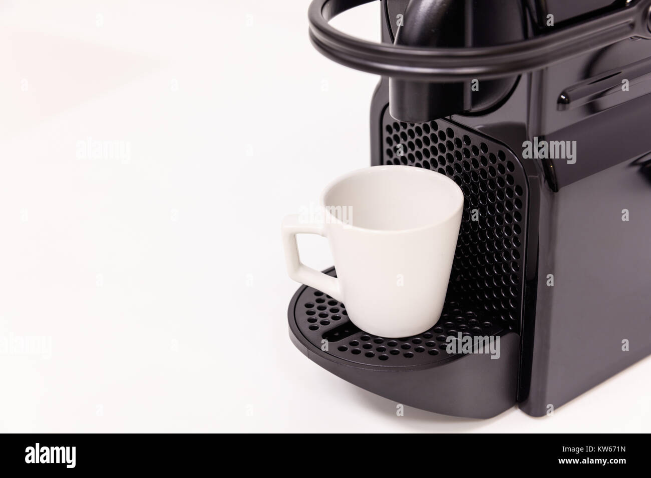 Espresso coffee maker machine with modern design. White background, close up view with details. Stock Photo