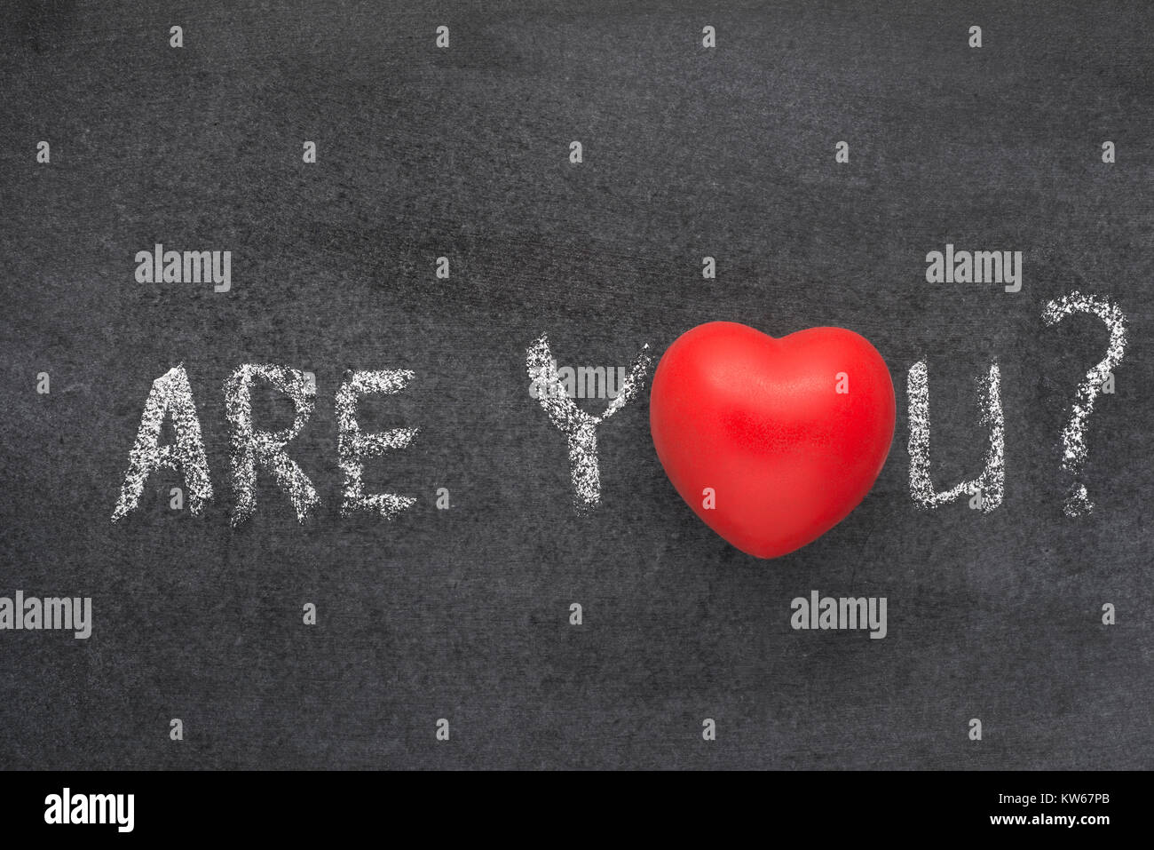 are you question handwritten on blackboard with heart symbol instead of O Stock Photo