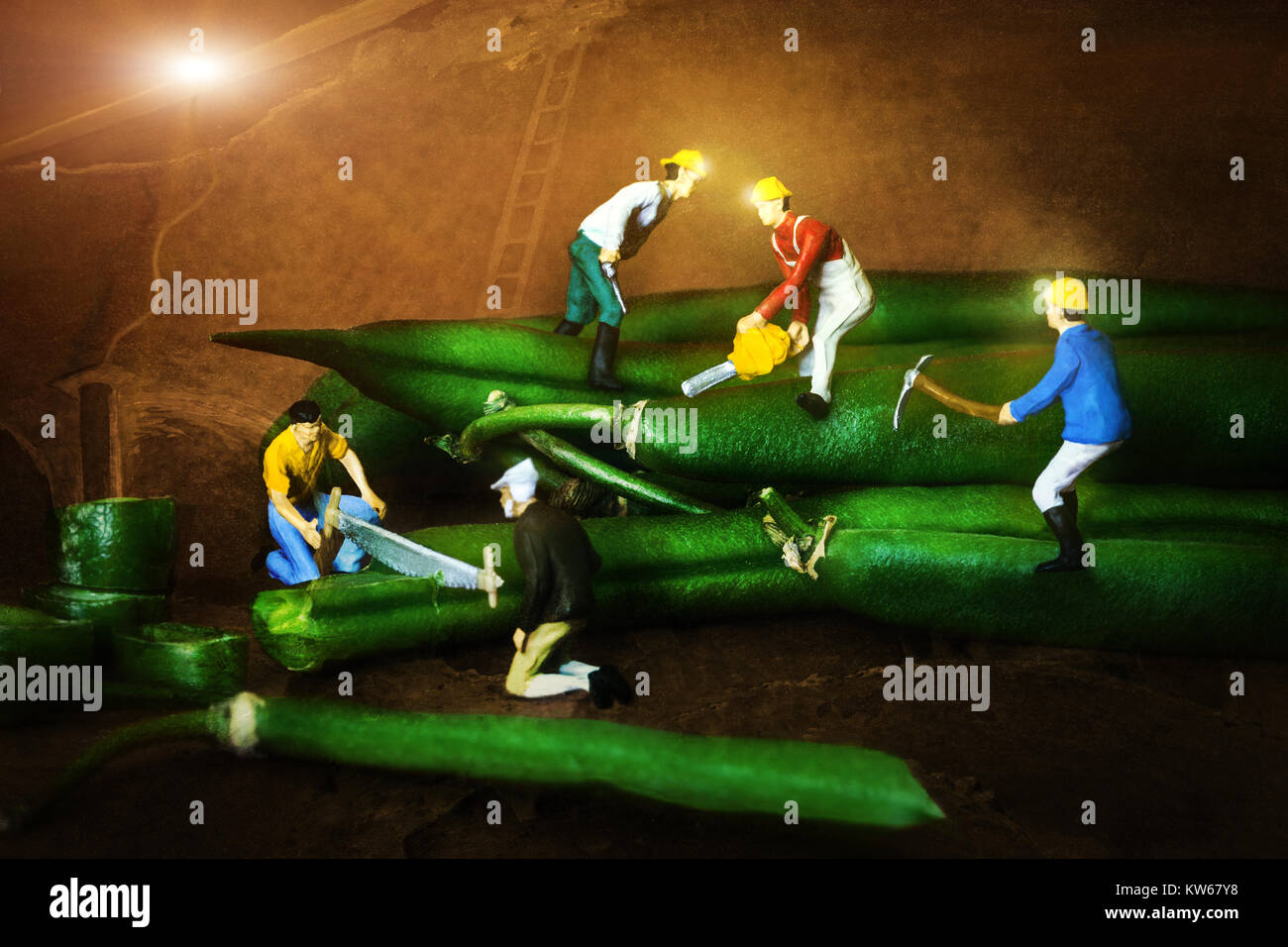 Miniature figurines conceptual, processing the green beans underground operation Stock Photo