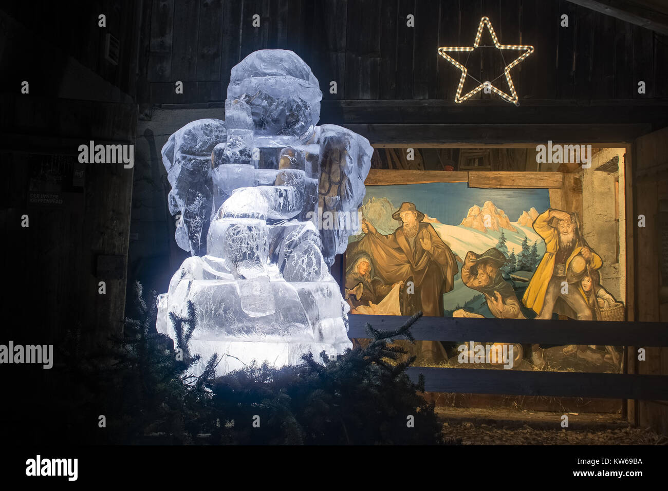 ice angel with painting and star in background imst tyrol Stock Photo