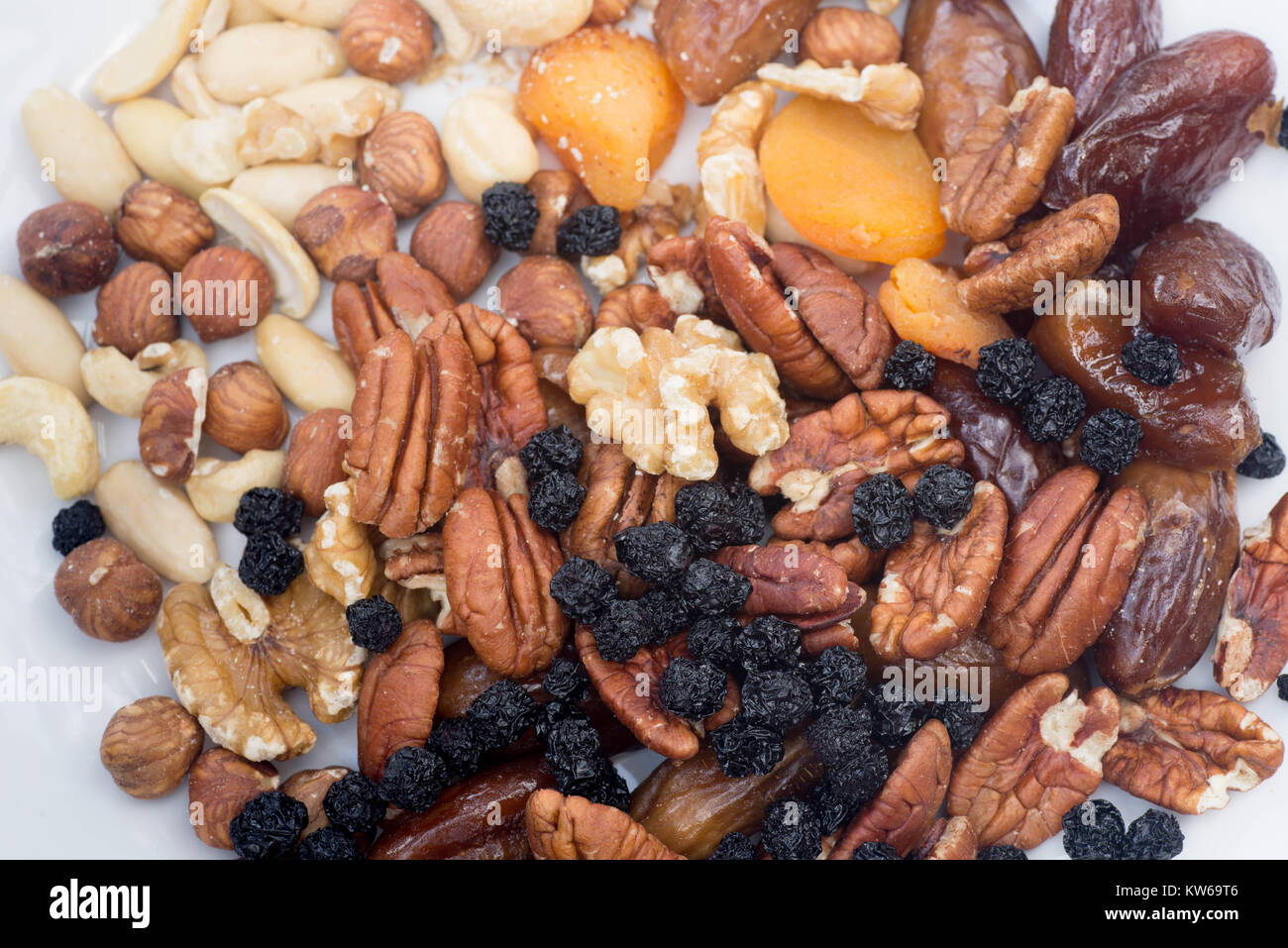 mixed dried fruits and nuts on plate Stock Photo