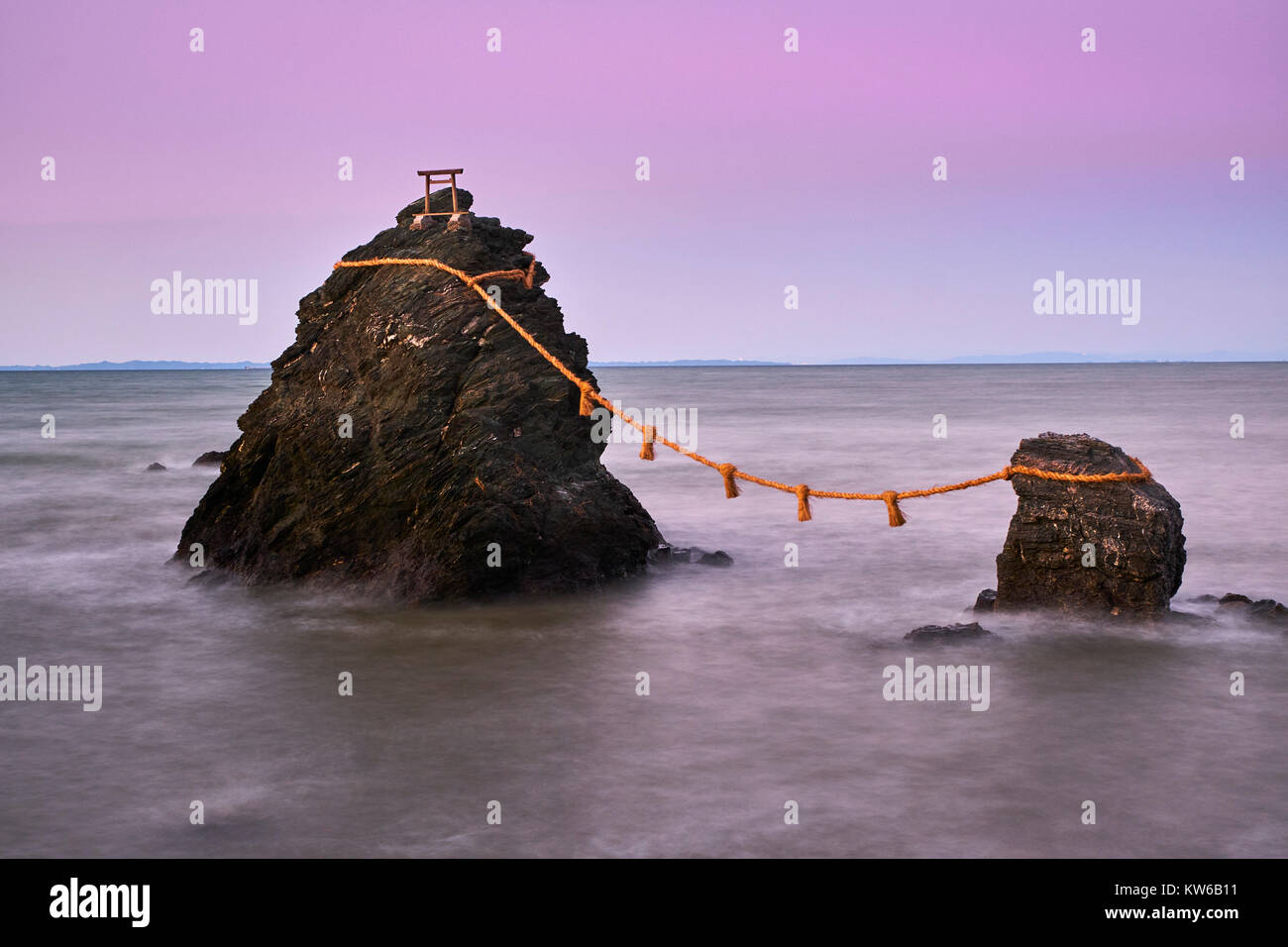 Japan, Honshu island, Ise Shima, Mie region, Futami, Meoto-Iwa (Wedded Rocks), two rocks considered to be male and female, joined in matrimony by shim Stock Photo