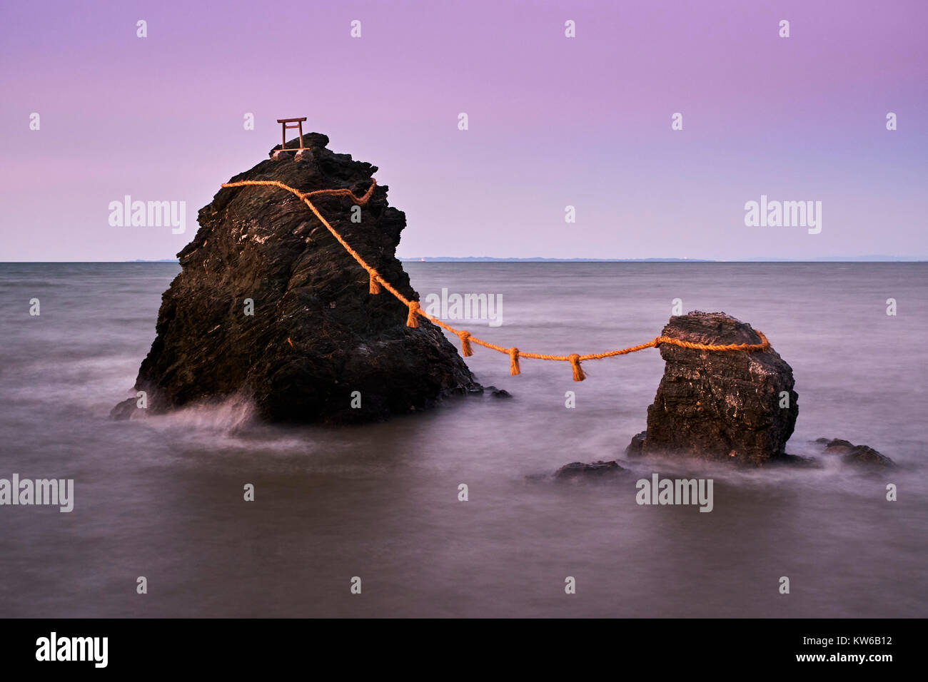 Japan, Honshu island, Ise Shima, Mie region, Futami, Meoto-Iwa (Wedded Rocks), two rocks considered to be male and female, joined in matrimony by shim Stock Photo