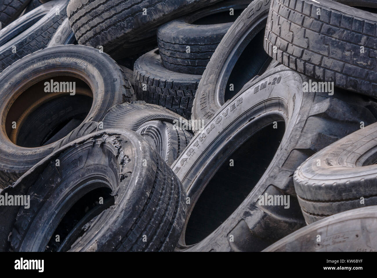 Pile of worn vehicle tryes ready for recycling Stock Photo