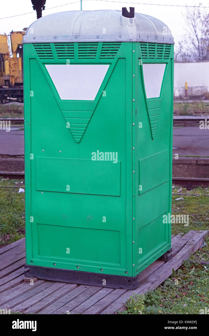 Temporary portable green toilet cabin Stock Photo
