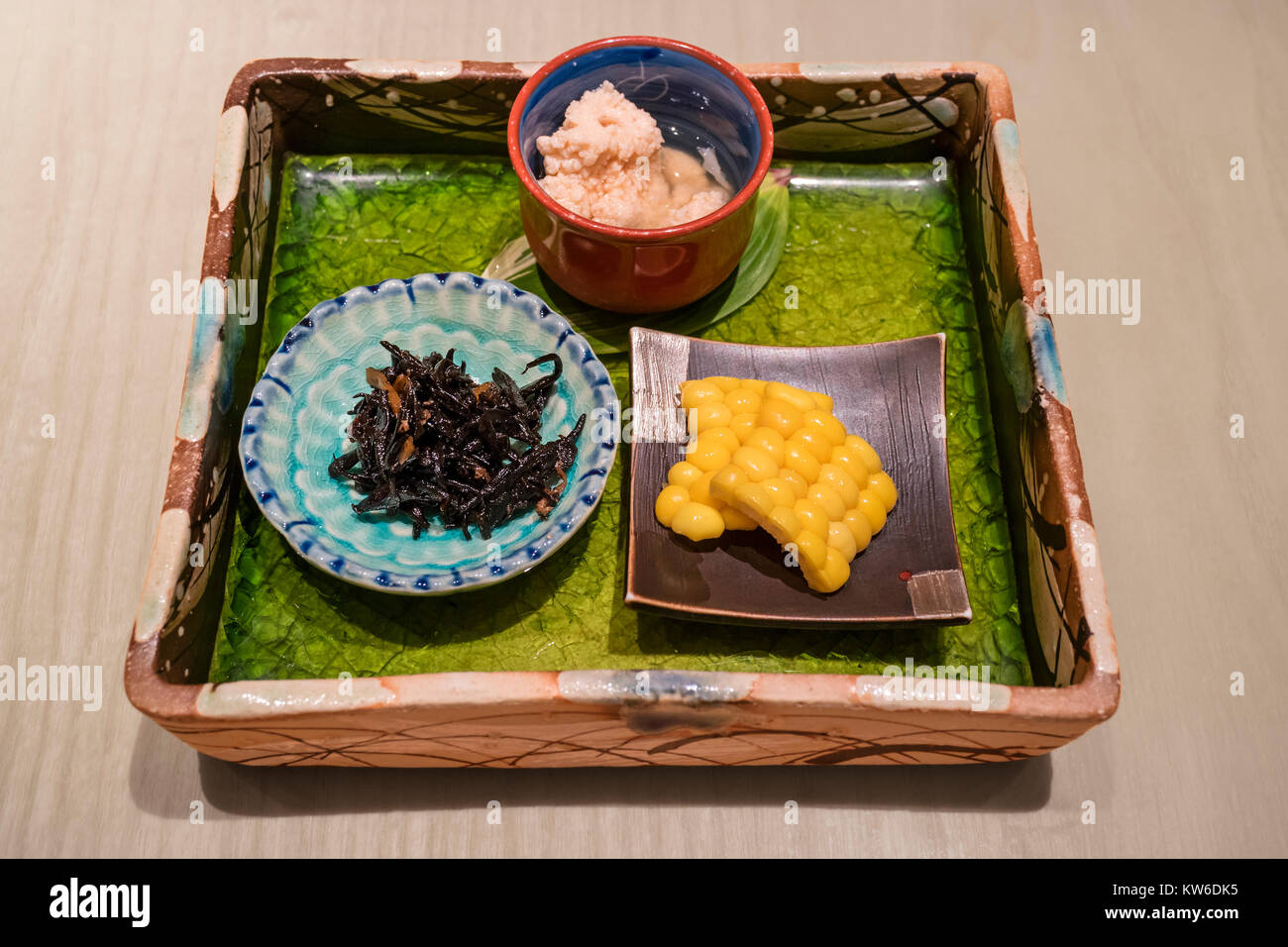 Tokyo - Japan, June 18, 2017; Traditional delicate served dish with corn, seaweed and fish eggs Stock Photo