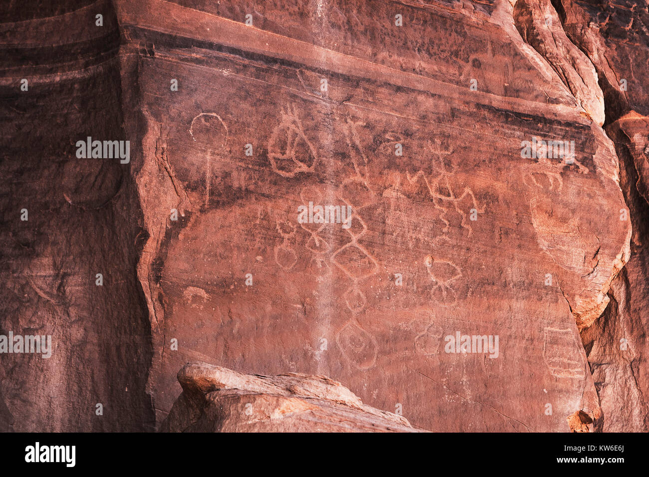 Carved Anasazi petroglyphs representing esoteric symbols on a sandstone cliff in the Canyon de Chelly National Monument, Chinle, Arizona, USA. Stock Photo