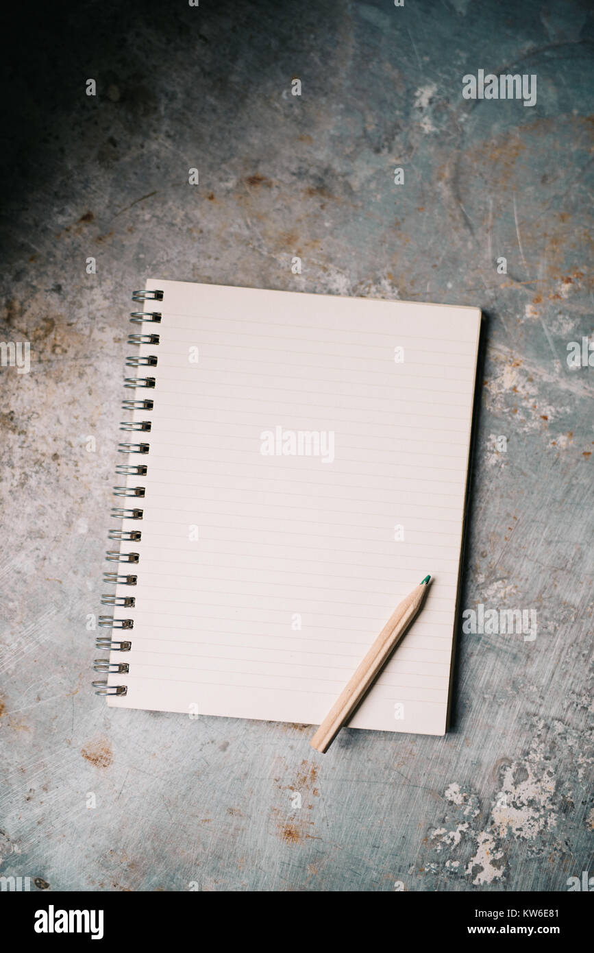 Blank white notepad on old metal surface Stock Photo - Alamy