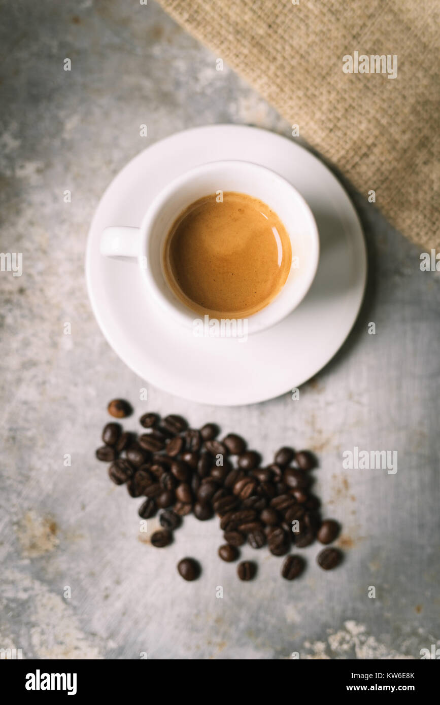 Fresh espresso on old metal surface Stock Photo