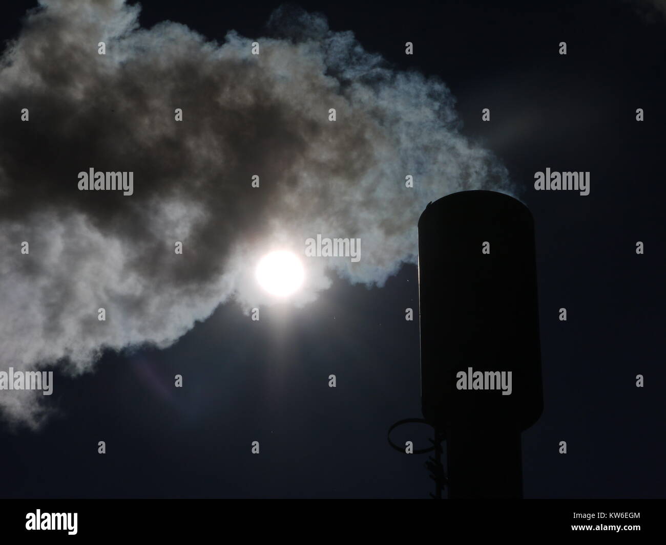industrial smoke from chimney on blue sky Stock Photo - Alamy