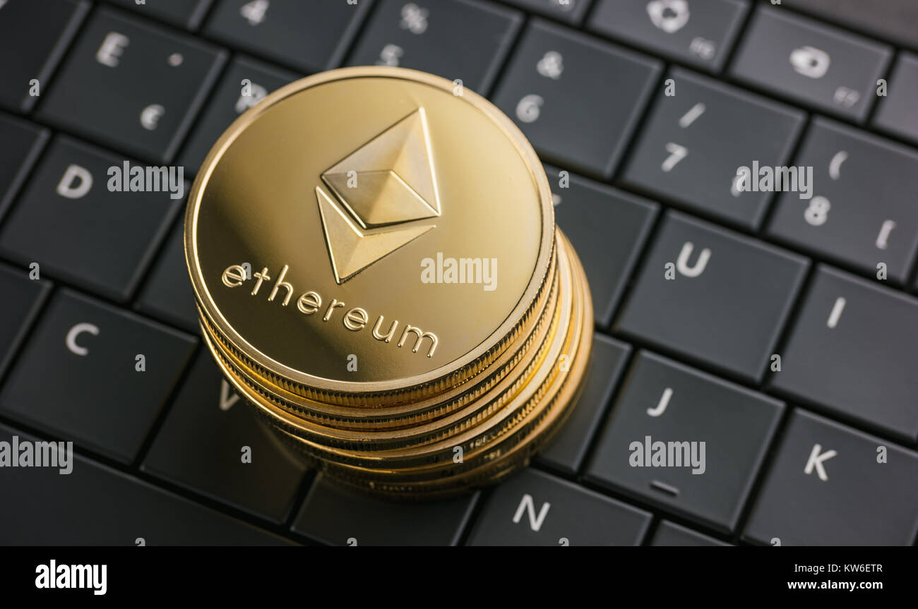 Stack of crypto coins with Ethereum on top, man hold magnifying glass,  crypto currency financial and business background photo Stock Photo - Alamy