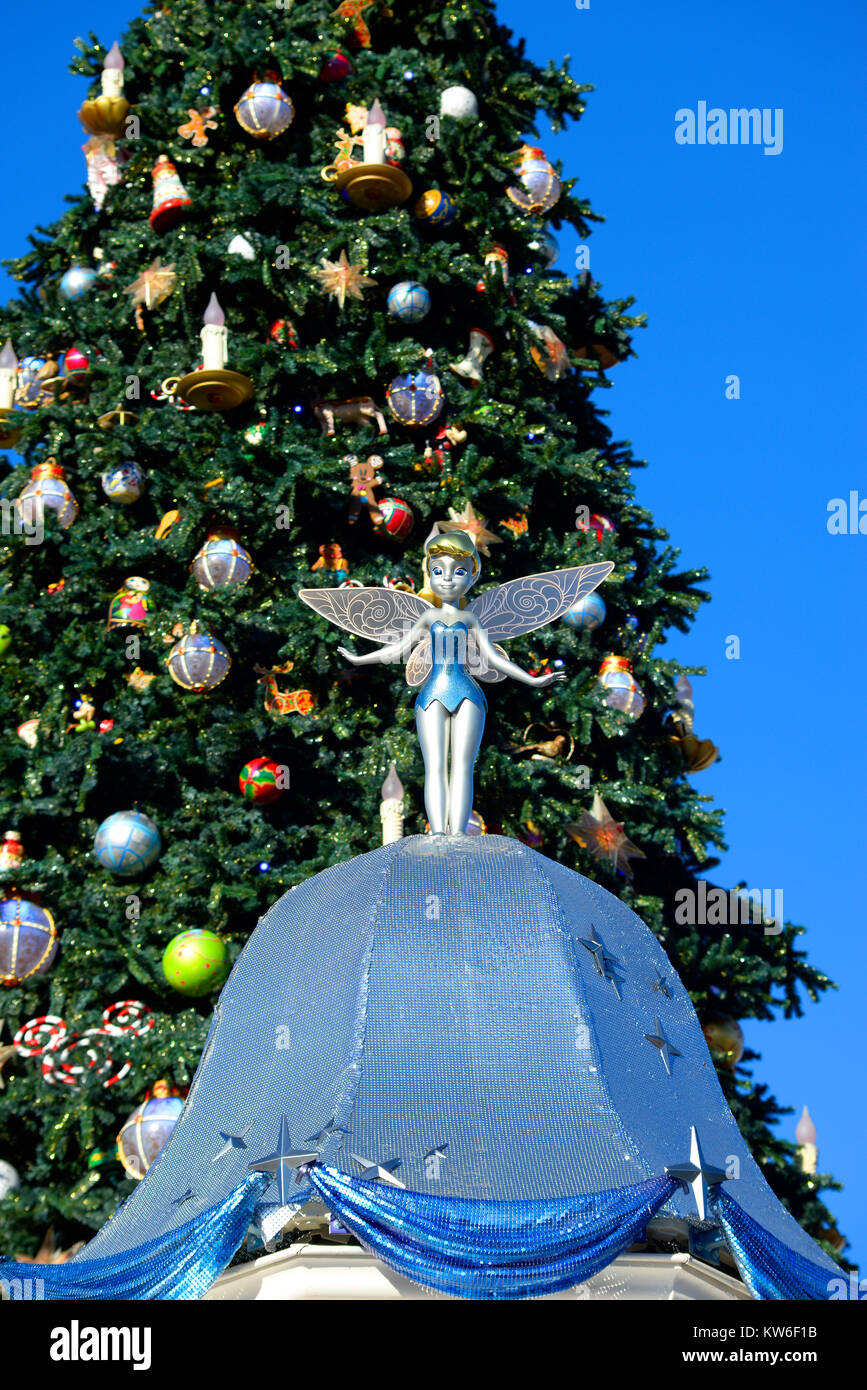 Tinkerbell figurine statue statuette DisneyLand Paris with Christmas tree. EuroDisney Theme park Stock Photo