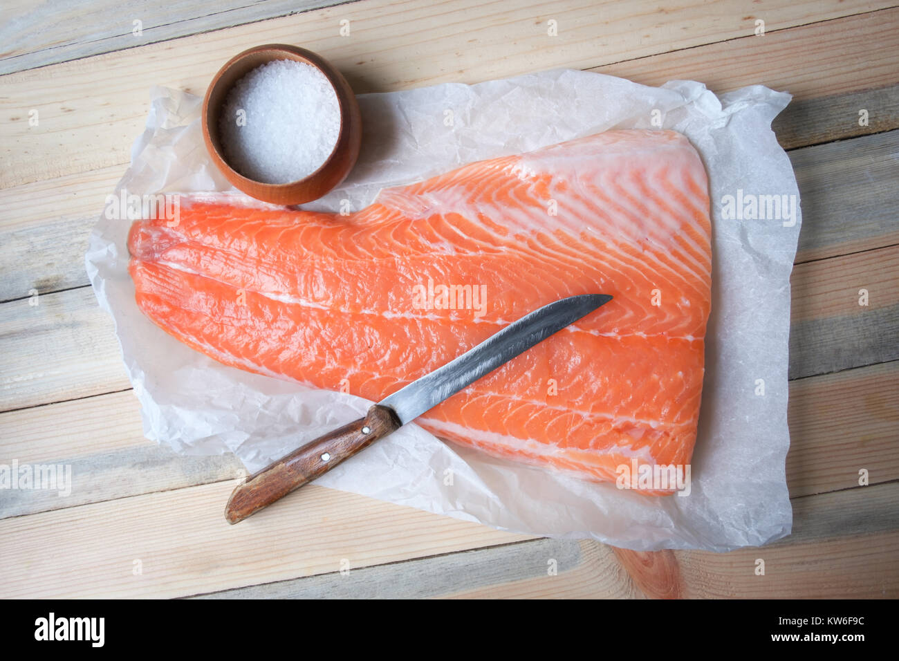 Fillet of salmon fish on wooden table Stock Photo