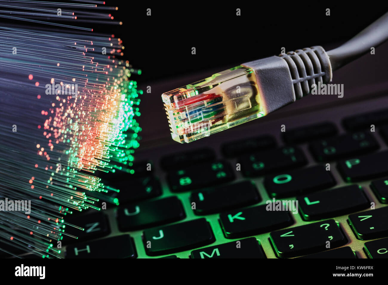 color fiber optical background with notebookk, Fiber optics lights abstract background Stock Photo