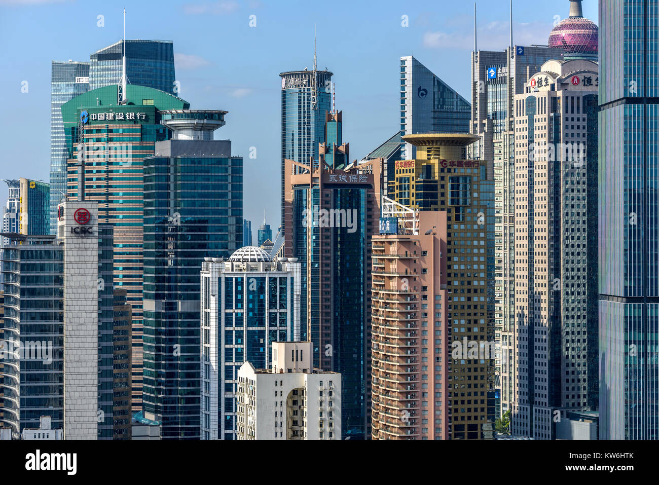 Crowded Shanghai Skyline - A closeup view of crowded modern office and residential buildings with sunny blue sky in Lujiazui, Pudong, Shanghai, China. Stock Photo