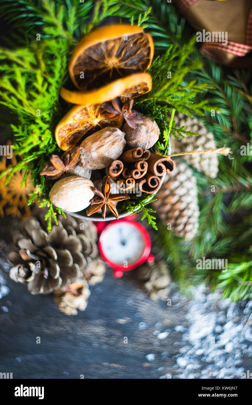 Christmas frame with fir tree branch, red berries and decorations on ...