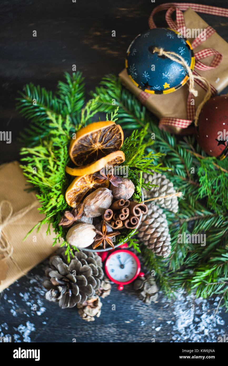 Christmas frame with fir tree branch, red berries and decorations on ...