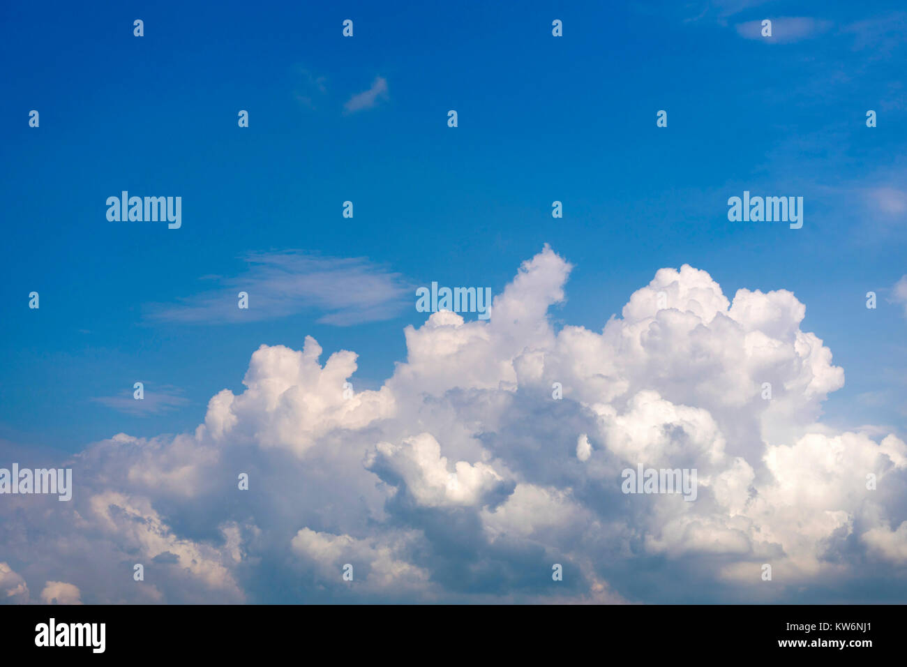 Fluffy cumulus clouds on light blue sky Stock Photo - Alamy