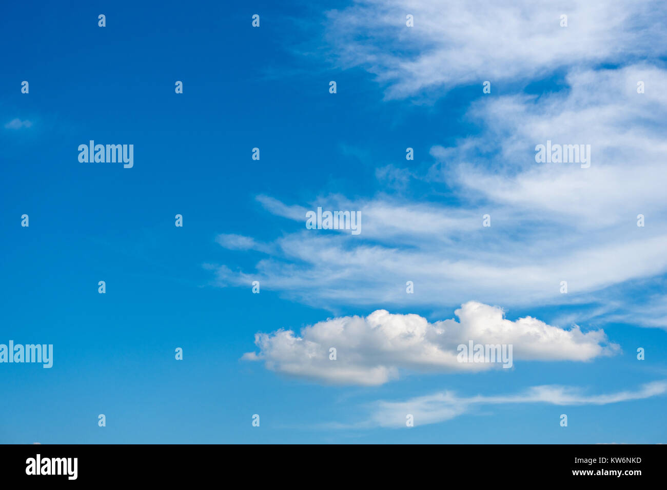 Sunny weather with cumulus clouds on bright blue sky Stock Photo - Alamy