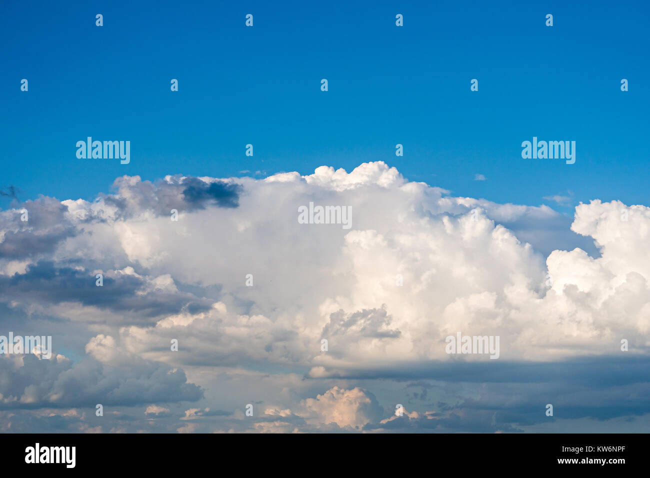 Sunny weather with cumulus clouds on bright blue sky Stock Photo - Alamy