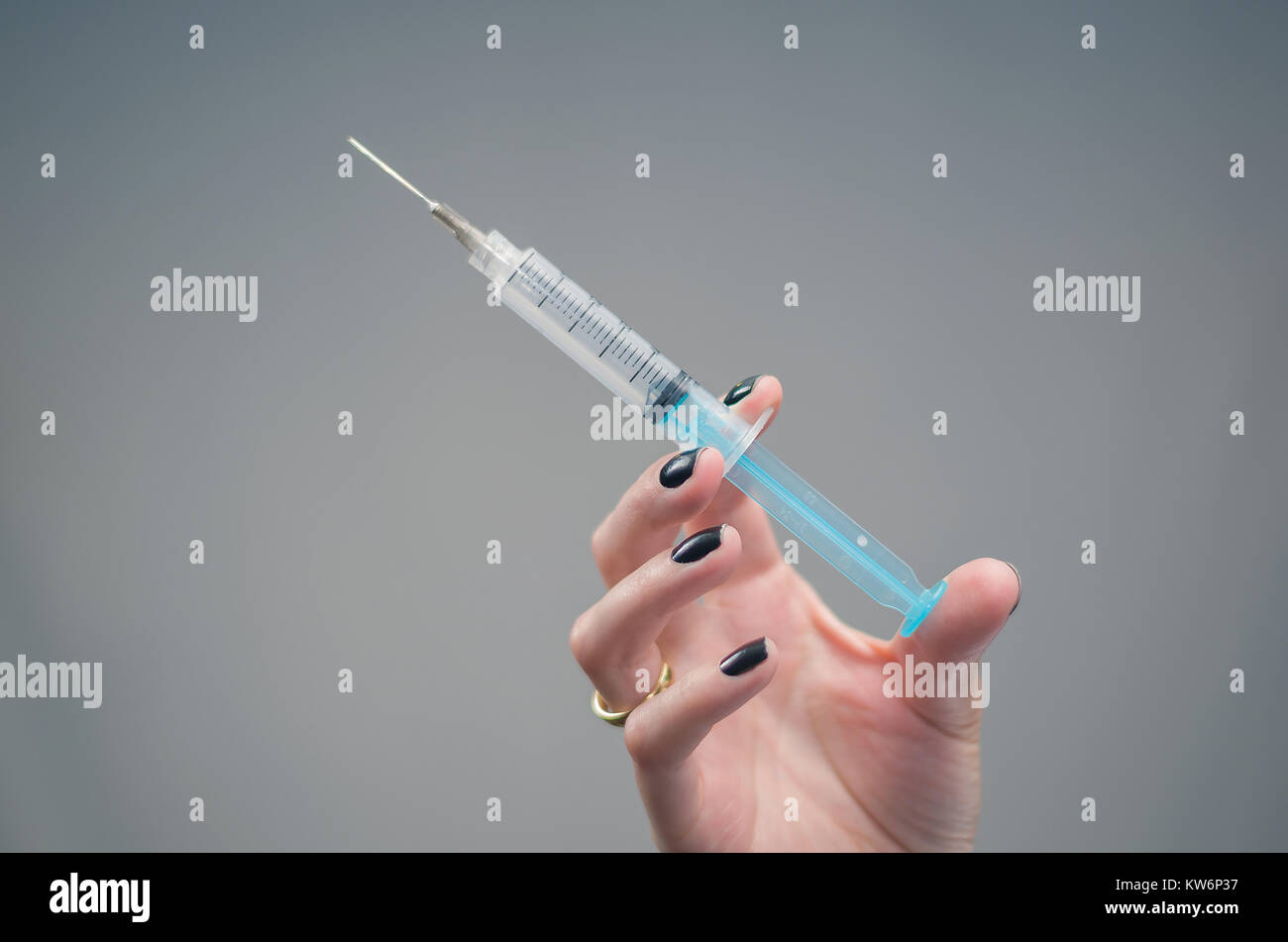 Great concept of medicine, hand holding injection syringe Stock Photo ...