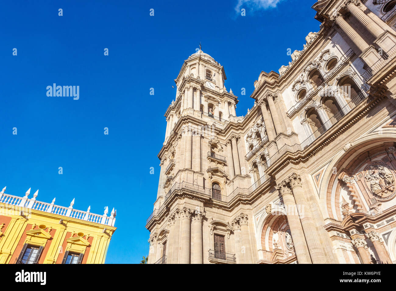 Malaga, Spain The Cathedral tower and the baroque facade of the bishops palace Stock Photo