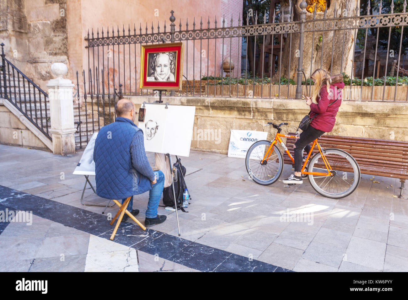 Spain Malaga Old Town with street artist at Cathedral Spain streets Stock Photo