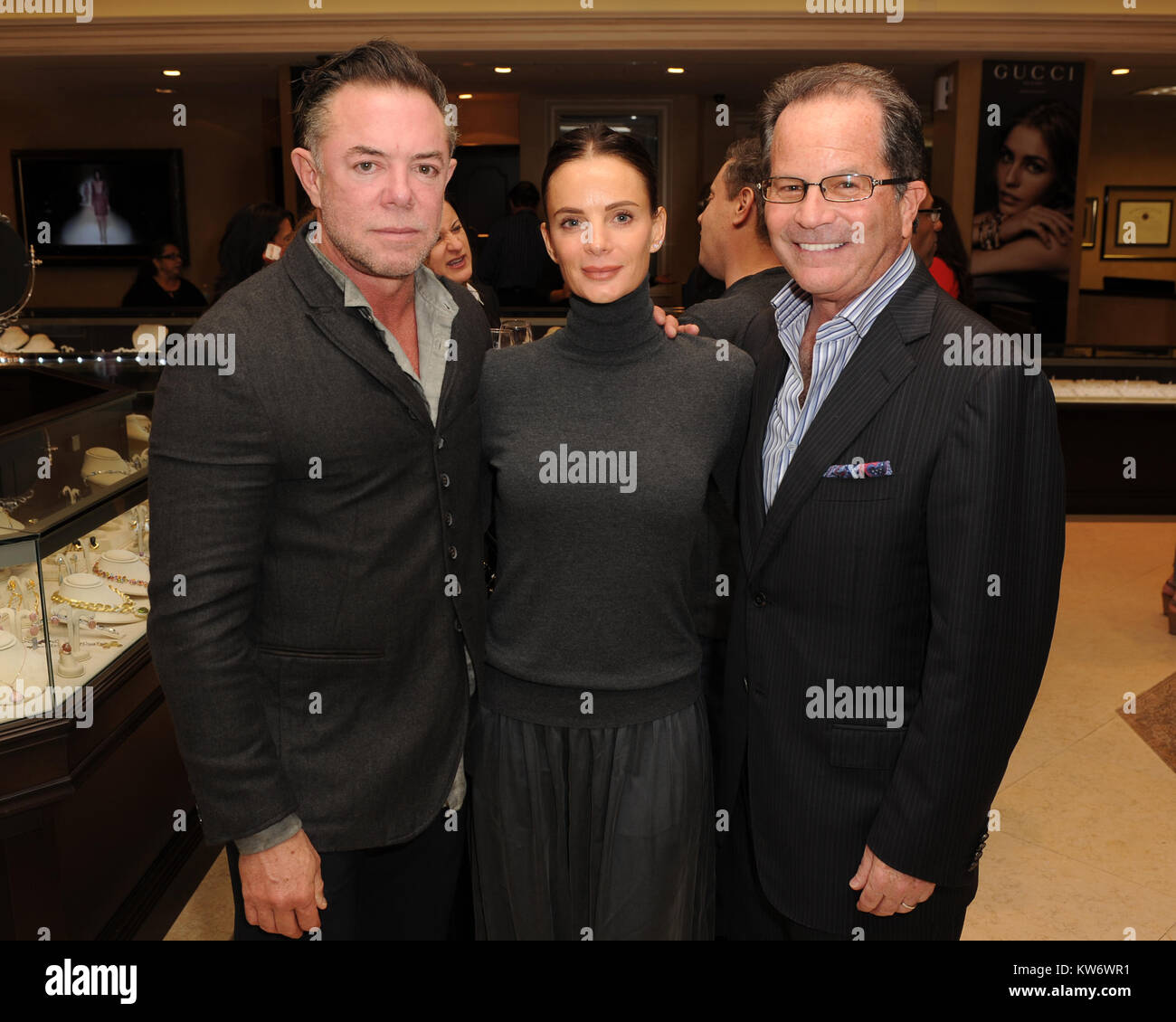 FORT LAUDERDALE FL - DECEMBER 11: Sharif Malik, Gabrielle Anwar, Marc  Levinson attend the Make A wish foundation gala sponsored by Gucci held at  Levinson Jewelers on December 11, 2014 in Fort