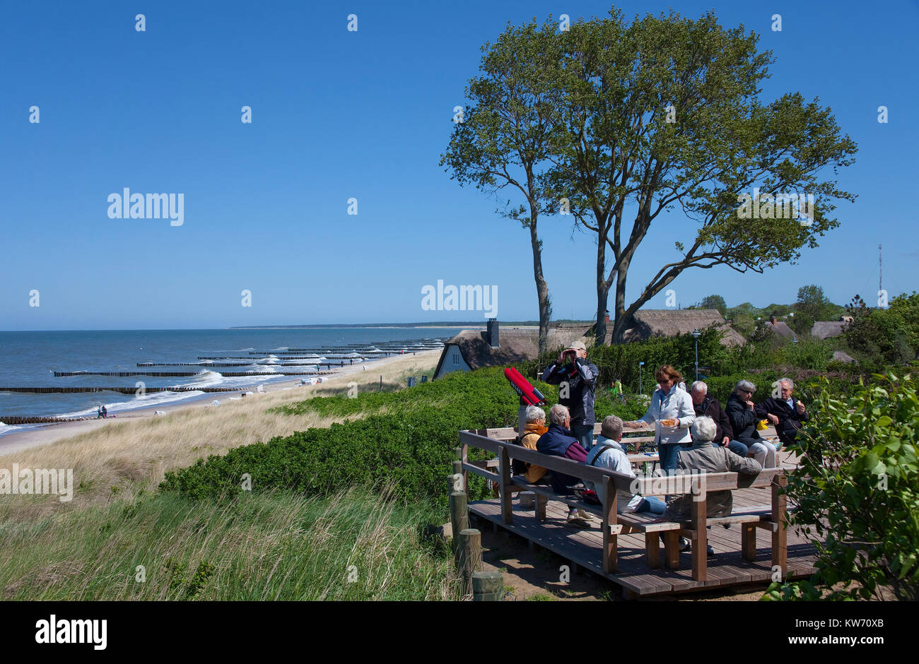 Tourists at the view point 'Hohes Ufer', thatched-roof houses and view on Baltic Sea, Ahrenshoop, Fishland, Mecklenburg-Western Pomerania, Germany Stock Photo