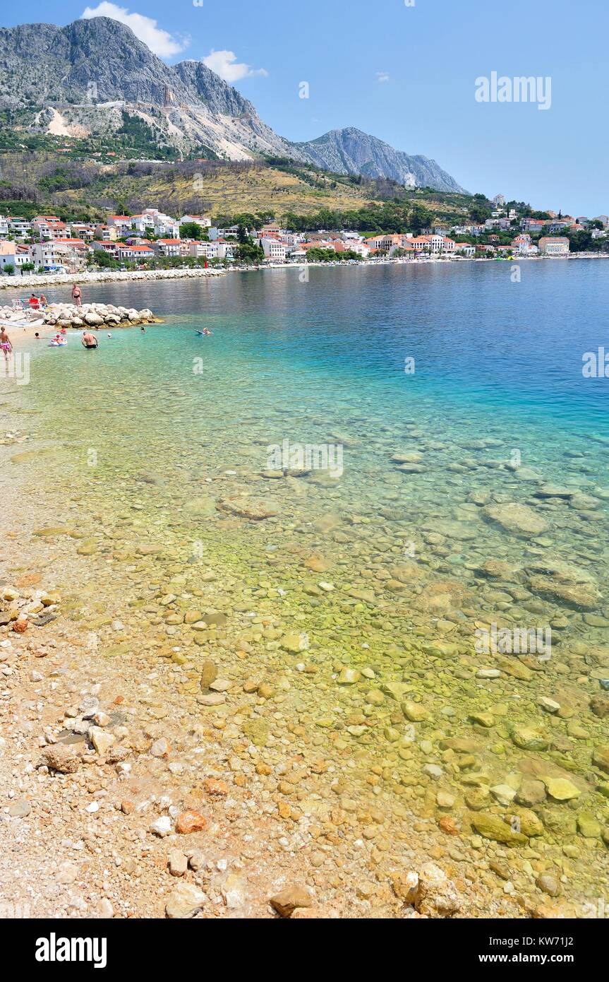 Adriatic sea at Podgora in Croatia with crystal clear sea and mountain Biokovo in background Stock Photo