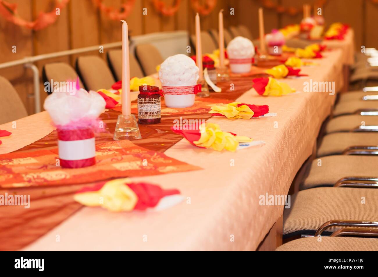 Decorated table with candles in the party. Selective focus. Stock Photo