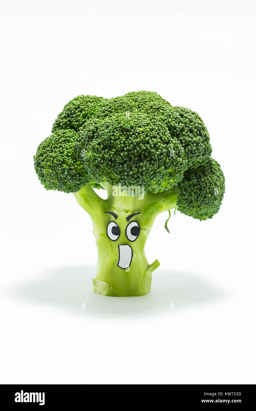 Closeup of fresh green broccoli with scared cartoon style face on white
