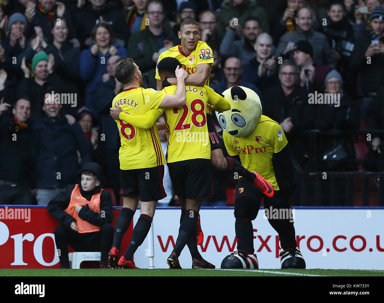 Watford players celebrate after Andre Carrillo (28) scores his side's first goal during the Premier League match at Vicarage Road, London. Stock Photo