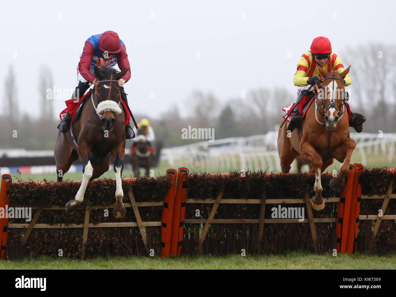 Poetic Rhythm and Paddy Brennan (right) clear the last flight before going on to win The Betfred Challow Novices' Hurdle Race run during the Betfred Challow Hurdle Day at Newbury Racecourse. Stock Photo