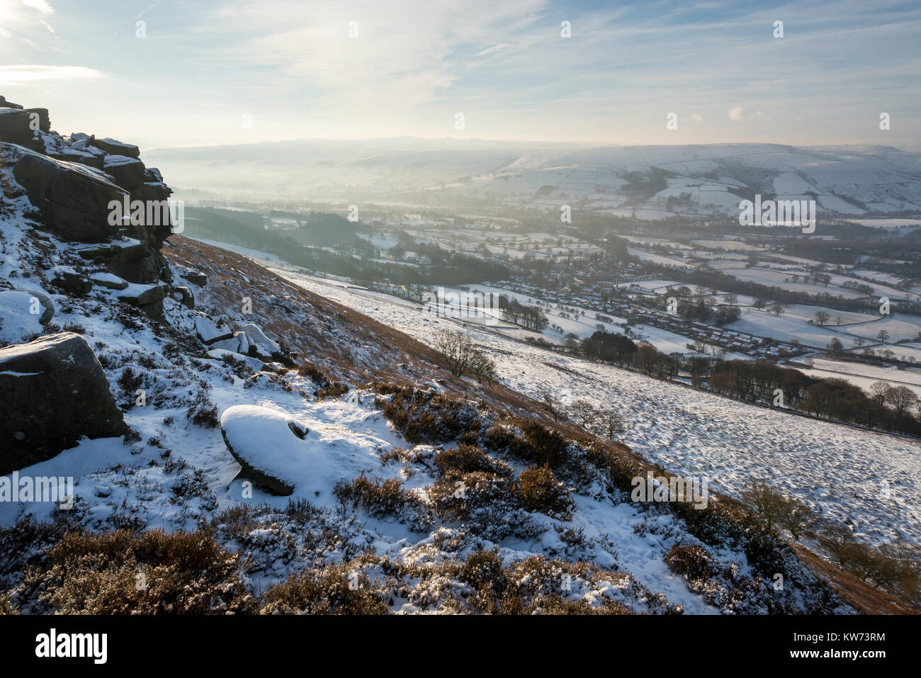 Snow covered abandoned millstone on Derwent edge in the Peak District, Derbyshire, England. Stock Photo