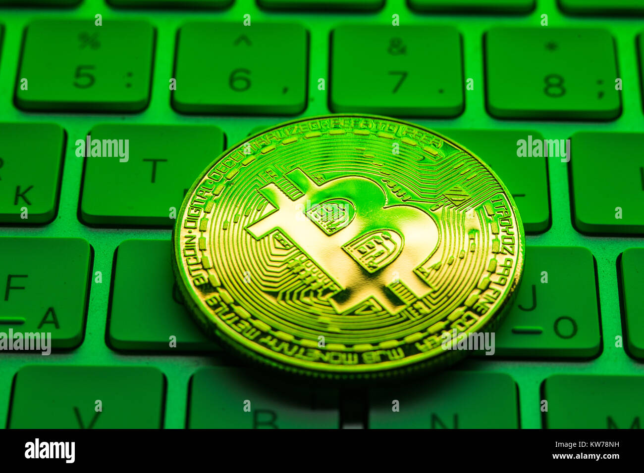gold plated bitcoin coin on black background Stock Photo - Alamy