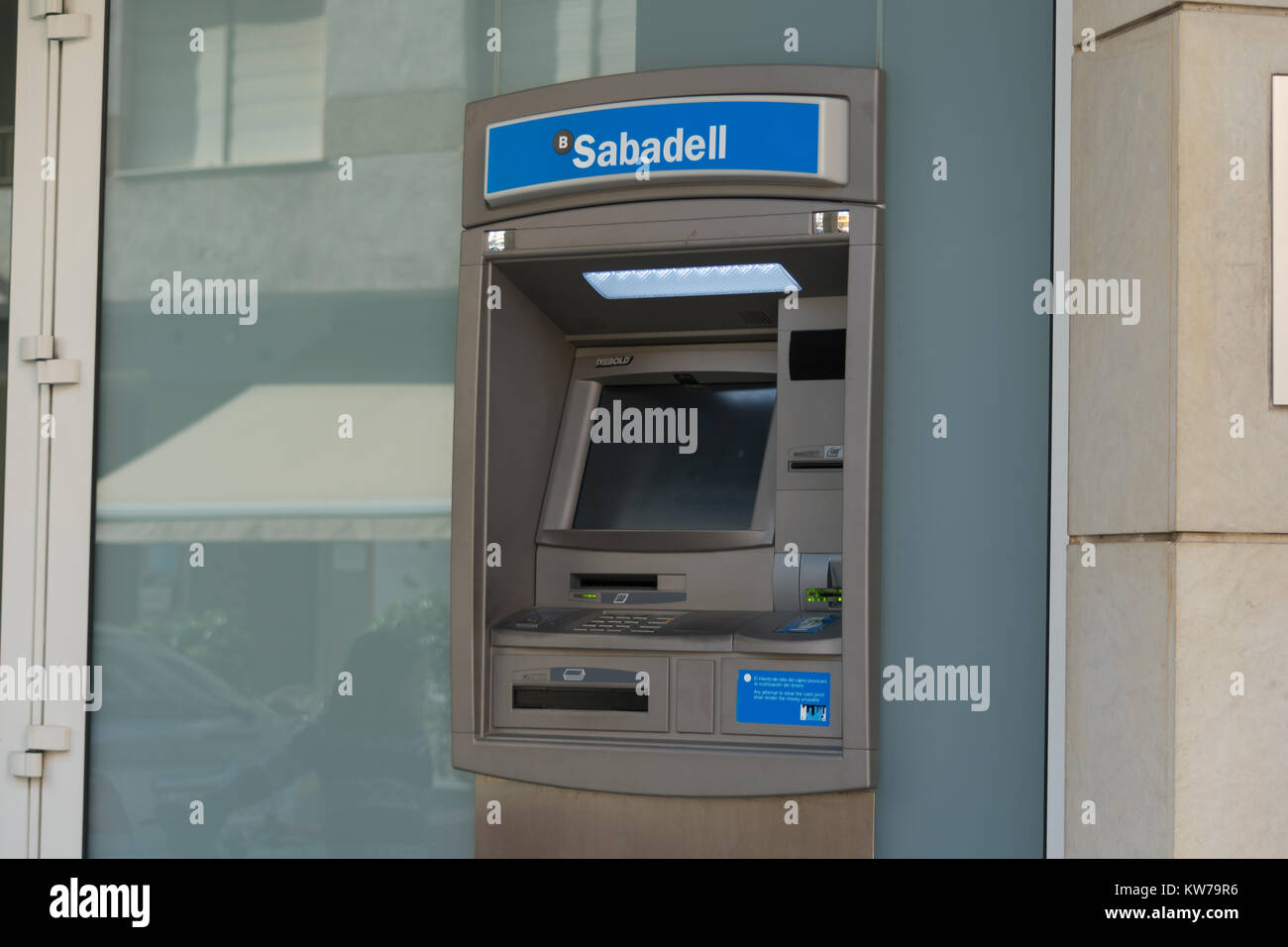 Guardamar del Segura, Alicante, Spain; December 8 2.017: Sabadell bank ATM cash machine outside street Stock Photo