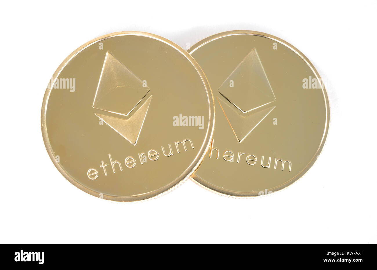 Two Real coin of cryptocurrency golden Ethereum isolated on white background Stock Photo