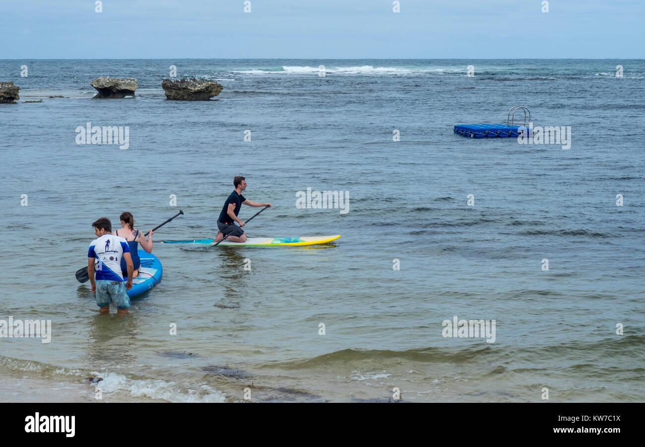 People people paddle boarding at Gnarabup Beach, Margaret River, Western Australia Stock Photo