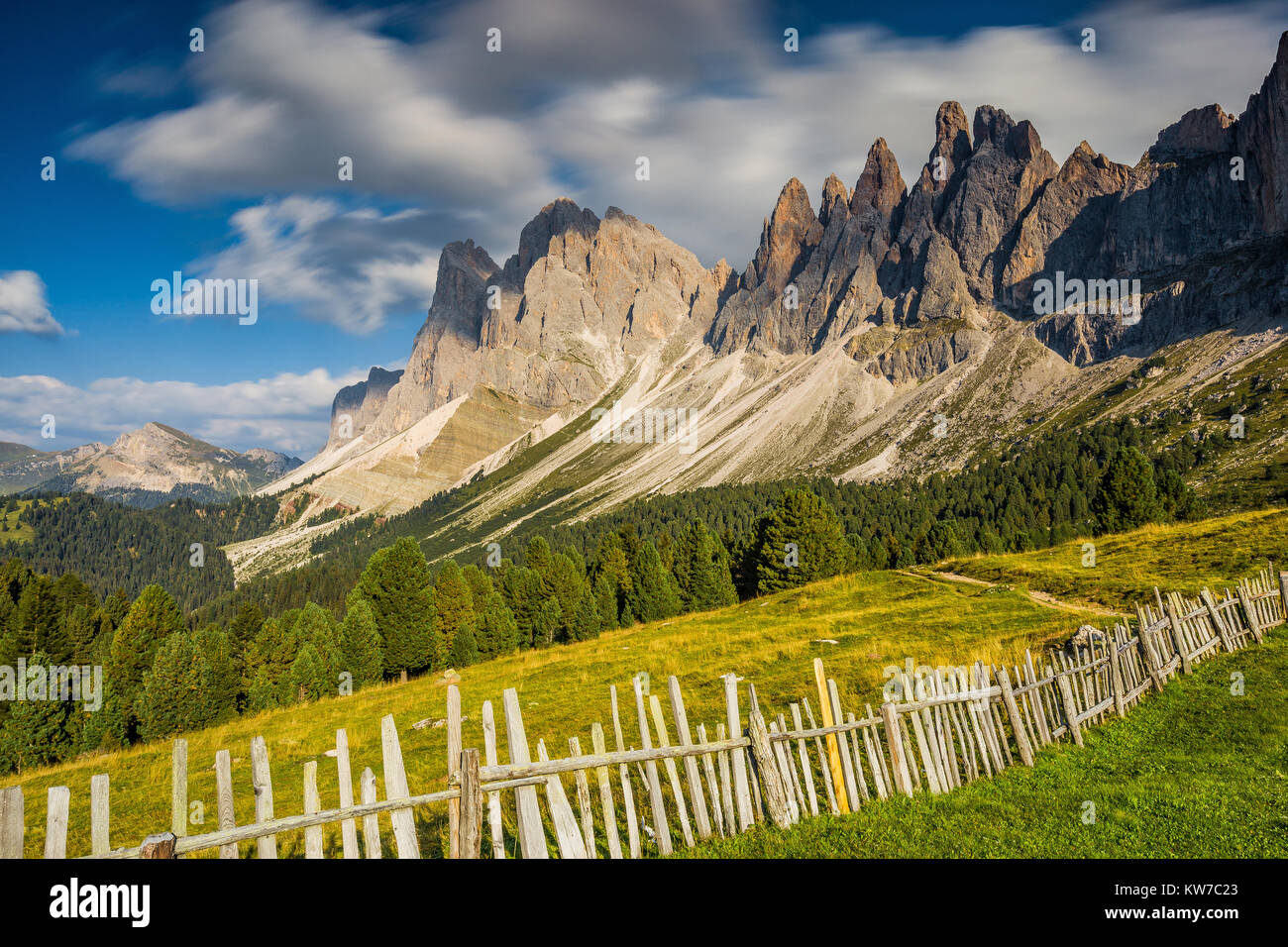 The Odle mountain group. Alpine grasslands, wooden fences in the Funes Valley. The Gardena Dolomites, South Tyrol, Italian Alps. Europe. Stock Photo