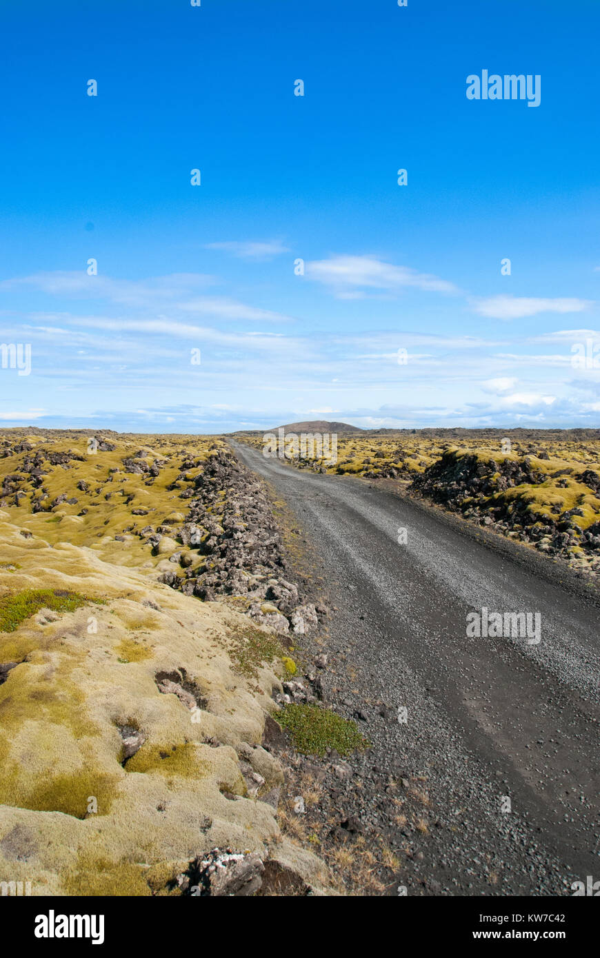 Barren landscape and gravel road in Iceland Stock Photo